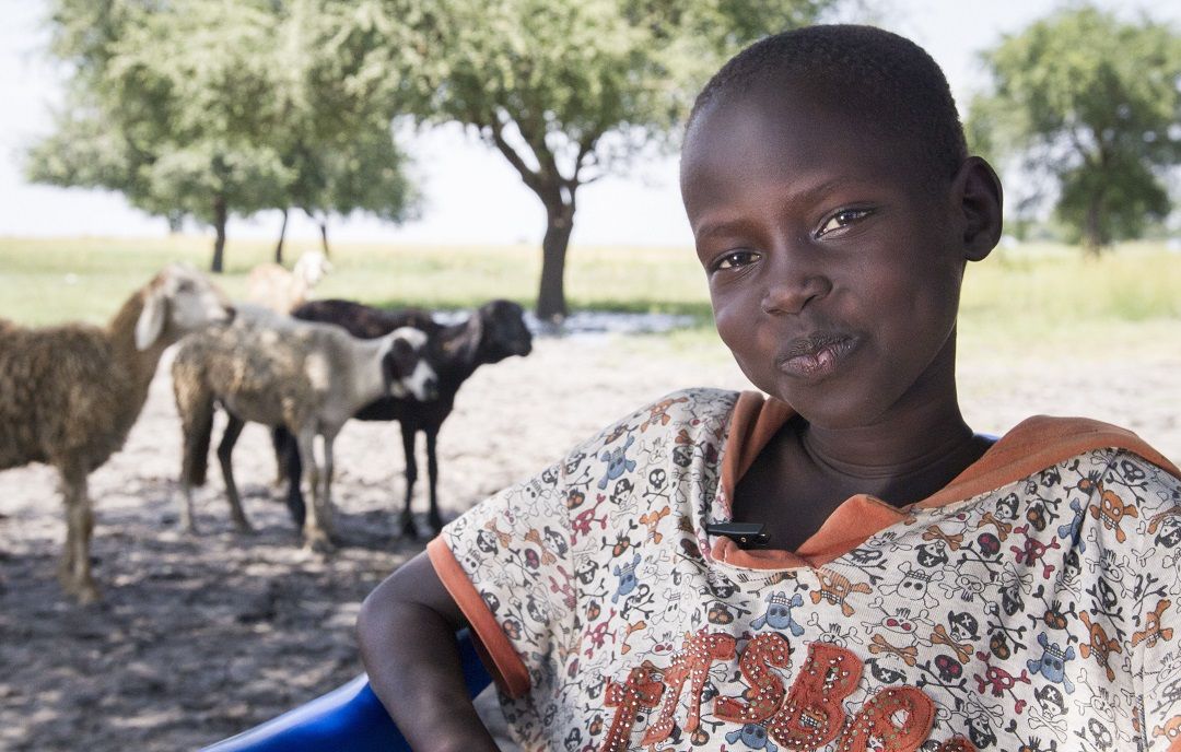 Nagnyet Dingay (8) smiles at Dingthoma IDP site in Melut, South Sudan