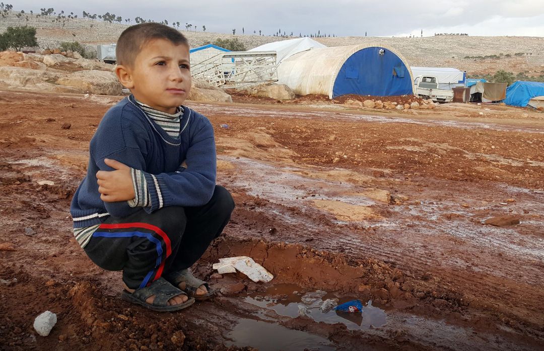 A young boy in a Syrian displacement camp. 